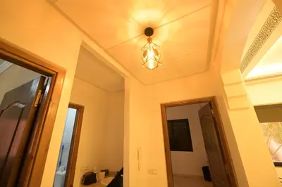 a room with a ceiling light and a hallway at Carisia Liam in Marrakech