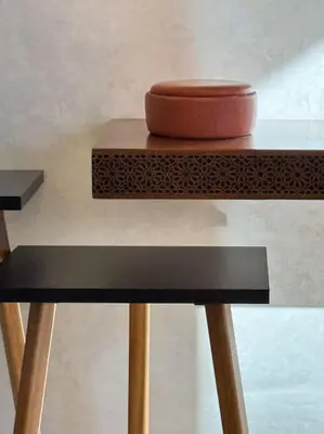 a wooden table with a bowl on top of it at Appartement Sylia in Marrakech