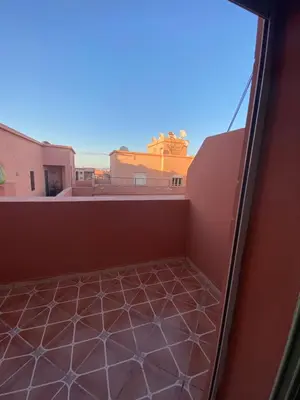 a balcony with a view of a building at Apparemment in Marrakech