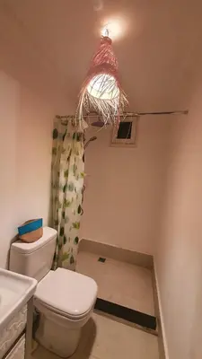 a bathroom with a toilet and a sink at Appartement T3 Le petit chat in Marrakech