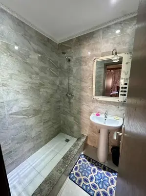 a bathroom with a sink and a mirror at 2B Flat City Center Marrakech in Marrakech