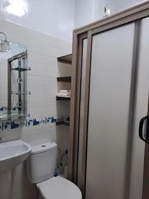 a bathroom with a toilet and a sink at Jardins d'Anas Appartement Airport in Marrakech