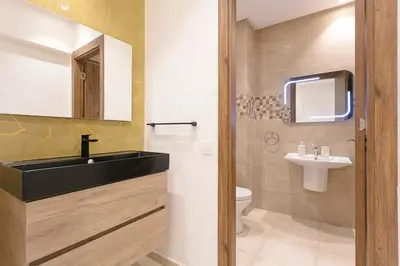 a bathroom with a sink and a toilet at Feel At Home Heart Of Marrakech in Marrakech