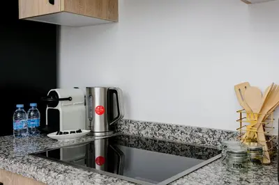 a kitchen counter with a sink and a coffee maker at Feel At Home Heart Of Marrakech in Marrakech