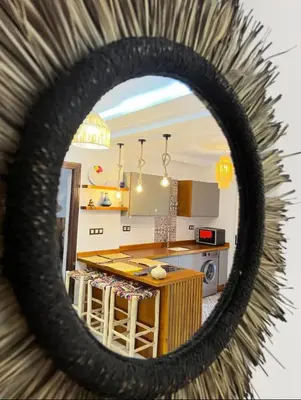 a kitchen with a counter and a large mirror at Dreamy Majorelle and Bohemian Majorelle in Marrakech
