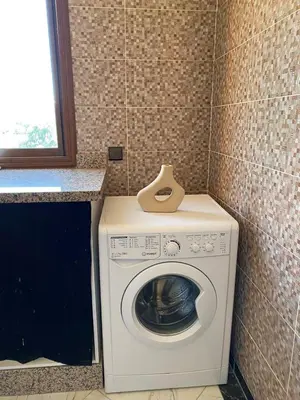a washer and dryer in a corner of a room at Full Moon APPARTS in Marrakech