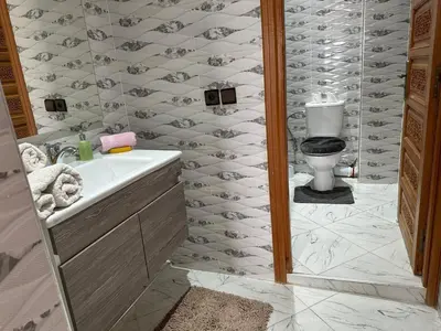 a bathroom with a sink and a toilet in it at Full Moon APPARTS in Marrakech