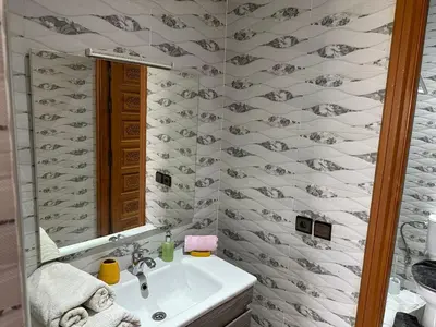 a bathroom with a sink and a mirror at Full Moon APPARTS in Marrakech