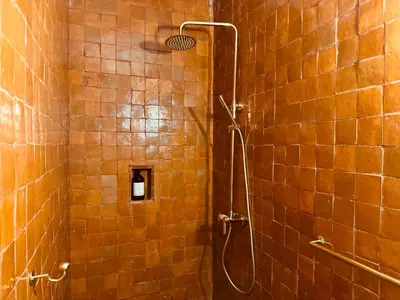 a bathroom with a shower with a shower head at Riad SASHA Exclusive&New Pool 6 pax Free Breakfast in Marrakech