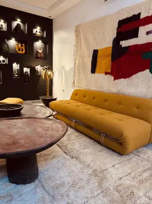 a living room with a yellow couch and a table at Riad SASHA Exclusive&New Pool 6 pax Free Breakfast in Marrakech