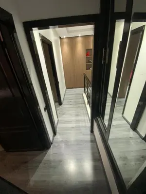 a hallway of a building with doors and a staircase at Residence marjane in Marrakech