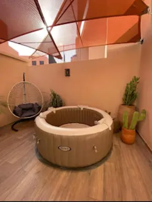 a dog bed in a room with a staircase at Luxueux Duplex 3 chambres à Victor Hugo in Marrakech