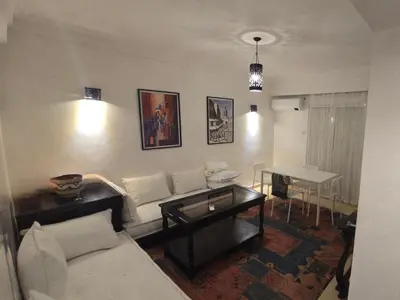 a living room with a couch and a table at Rita 83 in Marrakech
