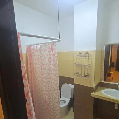 a small bathroom with a toilet and a sink at Rita 83 in Marrakech