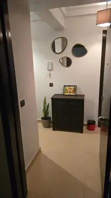 a hallway with a room with two mirrors on the wall at Rita 83 in Marrakech
