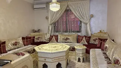 a living room with couches and a table at Family flat in Marrakech in Marrakech