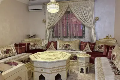 a living room with a couch and a window at Family flat in Marrakech in Marrakech