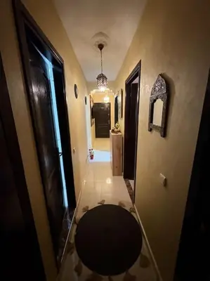 a hallway with a bathroom with a toilet in it at Family flat in Marrakech in Marrakech