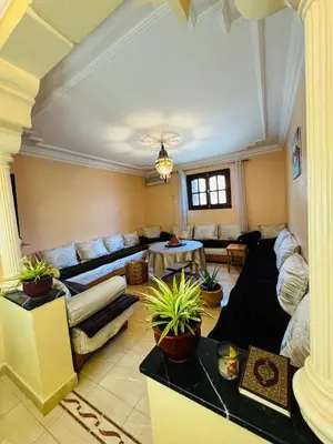 a large living room with couches and plants at B and b in our house in Marrakech