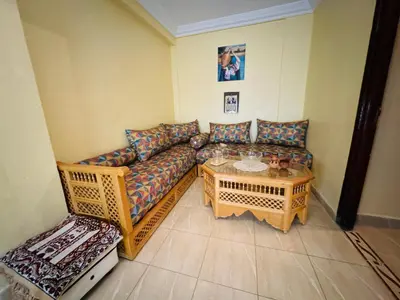 a living room with a couch and a table at B and b in our house in Marrakech