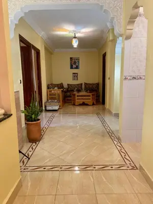 a living room with a couch and a table at B and b in our house in Marrakech