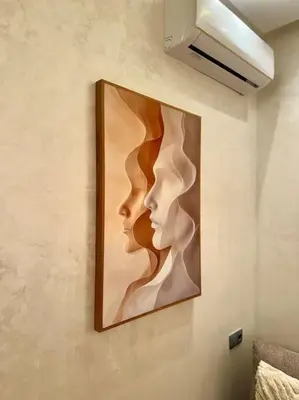 a painting of two heads on a wall at Yumo - Cozy 2 in Marrakech
