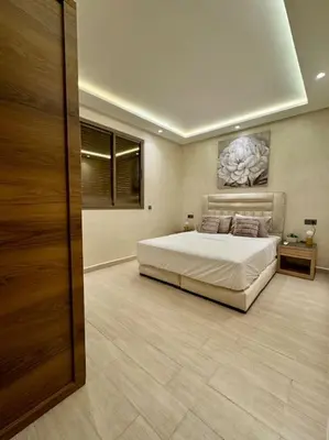 a bedroom with a large bed in a room at Yumo - Cozy 2 in Marrakech