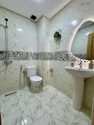 a bathroom with a toilet and a sink at Yumo - Cozy 2 in Marrakech