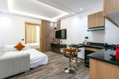 a hotel room with a bed and a desk at L'Eden Suite - Marrakech Centre in Marrakech