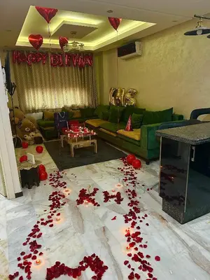 a living room with red rose petals on the floor at Heart of Marrakech city center - Gueliz in Marrakech