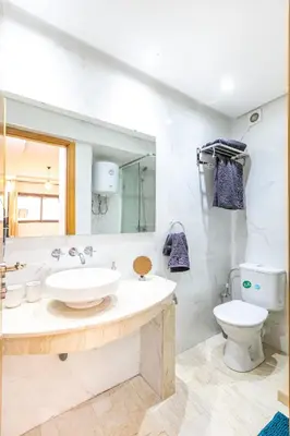 a bathroom with a sink and a toilet at Appartement chic et moderne in Marrakech