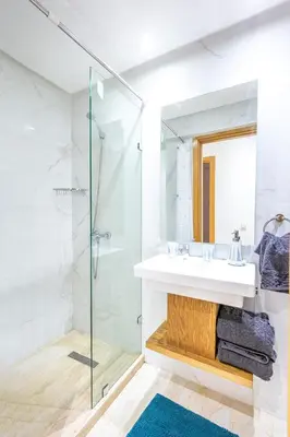 a bathroom with a sink and a shower at Appartement chic et moderne in Marrakech