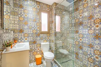 a bathroom with a toilet and a shower at Serene Oasis Pool & Garden View in Marrakech
