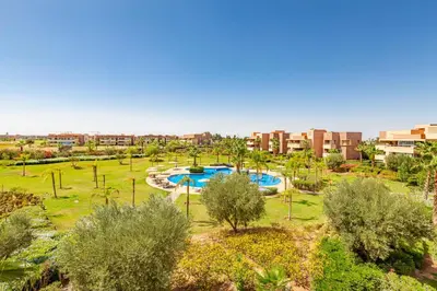 an aerial view of a park with two pools at Serene Oasis Pool & Garden View in Marrakech