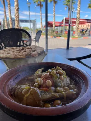 a bowl of food sitting on top of a table at Cozy Urbain Appartement in Marrakech