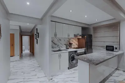 a kitchen with a sink and a stove top oven at Zenitude séjournez en plein coeur de Marrakech in Marrakech
