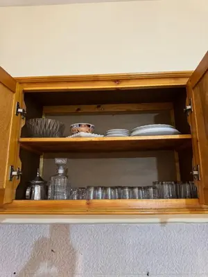 a cabinet with plates and dishes in it at TOP couple apartment in Marrakech