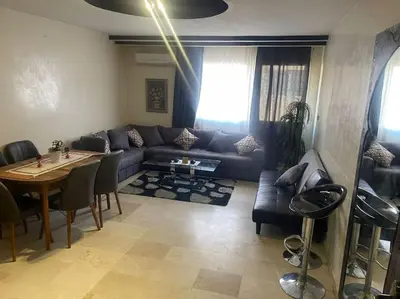 a living room with a couch and a table at Appartement de Lux,Guèliz in Marrakech