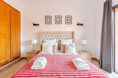 a bedroom with a large bed with two towels on it at Appartement au cœur de Marrakech in Marrakech