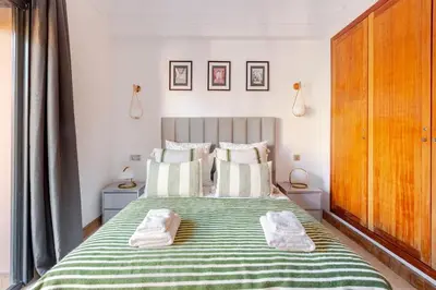 a bedroom with a bed with two towels on it at Appartement au cœur de Marrakech in Marrakech