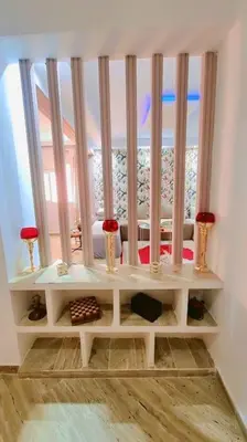 a shelf in a room with a window at Spacieux Studio by Nina in Marrakech