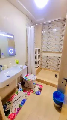 a bathroom with a toilet and a sink at Spacieux Studio by Nina in Marrakech
