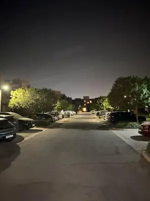 an empty street at night with cars parked at GOLF PRESTIGIA Résidence TOPAZE in Marrakech