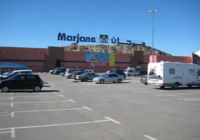 a parking lot with a sign that reads marmitemitemiteuseum at Appartement familiale top one saada in Marrakech