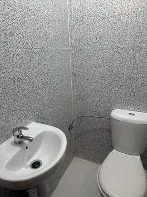 a bathroom with a white toilet and a sink at EuroOriental house in Marrakech