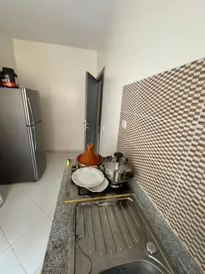 a kitchen with a stove with a pot on a counter at EuroOriental house in Marrakech