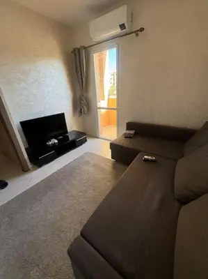 a living room with a couch and a window at EuroOriental house in Marrakech