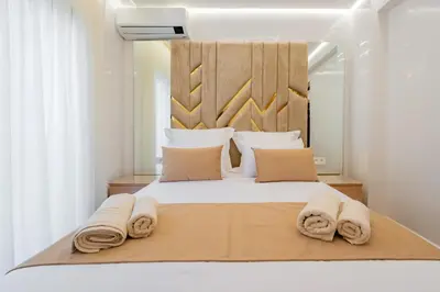 a bedroom with a large bed with towels on it at Appartement de luxe B5 1er in Marrakech