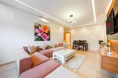 a living room with a couch and a table at VISTA HOLIDAYS ctm in Marrakech