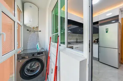 a laundry room with a washing machine in a house at VISTA HOLIDAYS Warda A31 in Marrakech